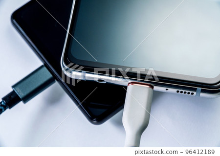 Scene close-up charging a smartphone 96412189