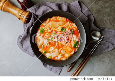 Korean food kimchi spicy kalguksu dish in black bowl 96414144