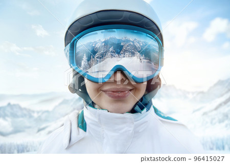 Woman At The Ski Resort On The Background Of Mountains And Blue Sky.A Mountain Range Reflected In The Ski Mask. Winter Sports. 96415027