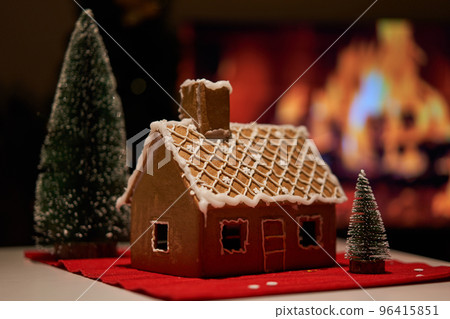 Decorated christmas gingerbread house in homely cozy atmosphere. Decorated christmas gingerbread house in homely cozy atmosphere. 96415851