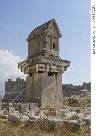 Ancient Greek stone tomb in the ancient city of Xanthos in Turkey. Ruins of ancient Greek civilization, stone objects of culture and art. 96417225