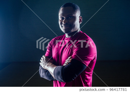 Black african american athletic man running on treadmills idoing exercises on muscle groups push up from the bench gym on black background Black african american athletic man running on treadmills idoing exercises on muscle groups push up from the bench gym on black background 96417781