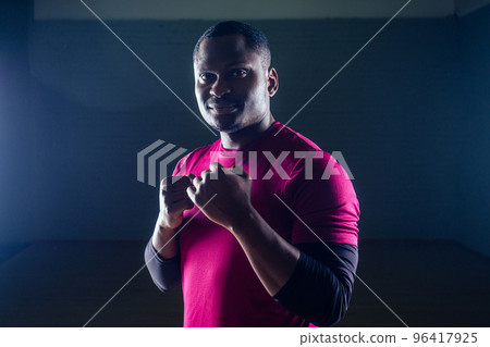 portrait of a young african american man sport boxer on fists black background gym dangerous menacing gaze hit portrait of a young african american man sport boxer on fists black background gym dangerous menacing gaze hit 96417925