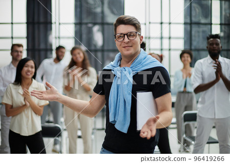 Happy diverse professional business team stand in office looking at camera Happy diverse professional business team stand in office looking at camera 96419266