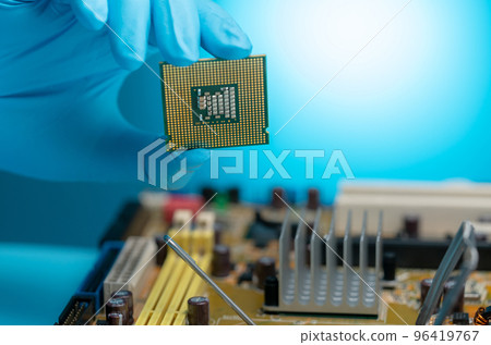 Electronic engineer hand holding computer chip. Chipset of electronic circuit board for PC motherboard. CPU chip. Electronic components. Computer hardware. Chip, semiconductor and trade war concept. 96419767