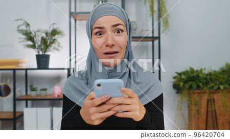 Businesswoman shocked by sudden victory on smartphone game winning lottery goal achievemen good news Businesswoman shocked by sudden victory on smartphone game winning lottery goal achievemen good news 96420704
