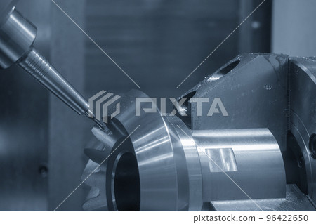 The 5-axis CNC milling machine cutting the metal gear part. The 5-axis CNC milling machine cutting the metal gear part. 96422650