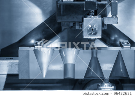 The wire EDM machine cutting the mold insert parts. 96422651