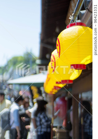 Bright yellow lanterns that color the approach to Konpiragu Shrine in Kagawa 96423331
