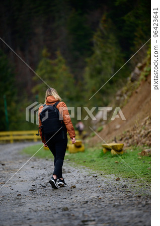 Tourist in the Carpathians, a girl on a background of mountains in the rehabilitation center of brown bears, Synevyr glade. Tourist in the Carpathians, a girl on a background of mountains in the rehabilitation center of brown bears, Synevyr glade. 96423641