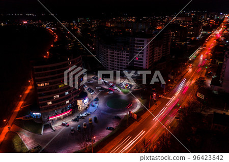Night streets, highway and car traffic in the city of Ivano-Frankivsk, lights from car traffic, top view of the street. 96423842