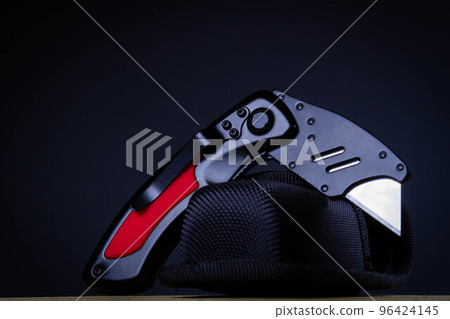 Universal powerful knife. Folding tool that cuts paper, plastic, cardboard and other dense materials. 96424145