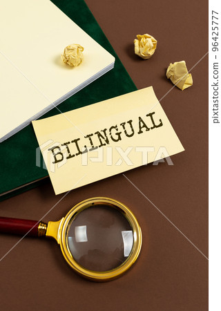 Text caption presenting Bilingual. Word Written on using or able to use two languages especially with equal fluency 96425777