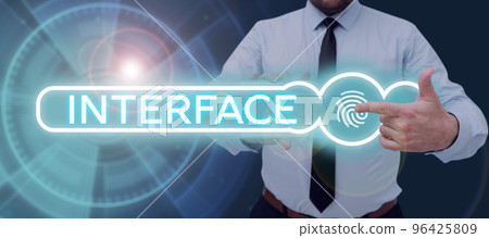 Text sign showing Interface. Business overview point of meeting and communicating between two structures Text sign showing Interface. Business overview point of meeting and communicating between two structures 96425809