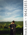 Young man traveller take a shot of nature ,beautiful green evironment 96425855