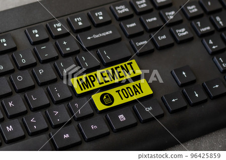 Hand writing sign Implement. Word Written on give practical effect to specific steps to ensure real attainment Hand writing sign Implement. Word Written on give practical effect to specific steps to ensure real attainment 96425859