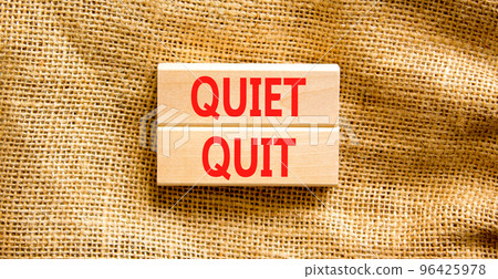 Quiet quit symbol. Concept words Quiet quit on wooden blocks. Beautiful canvas table canvas background. Business and quiet quit concept. Copy space. 96425978
