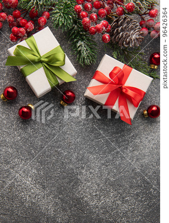 Fir Tree Decorations  On Black Concrete With Copy Space 96426364