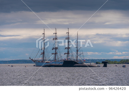 Russia. Kronstadt. July 31, 2022. A nuclear submarine and a sailing barque on the parade of the Navy. Russia. Kronstadt. July 31, 2022. A nuclear submarine and a sailing barque on the parade of the Navy. 96426420