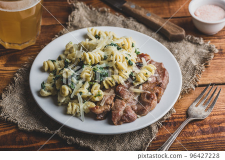 Fried Pork Steak and Spinach Pasta Fried Pork Steak and Spinach Pasta 96427228
