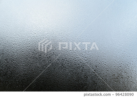 Dew drops and condensation on glass, cold season and high humidity on windows in houses. Dew drops and condensation on glass, cold season and high humidity on windows in houses. 96428090