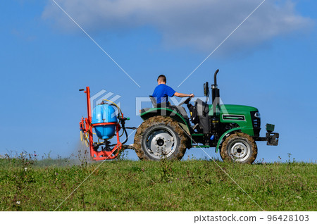 Treatment of the field with herbicides against pests and weeds. 96428103