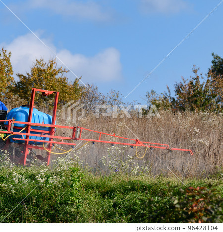 Treatment of the field with herbicides against pests and weeds. 96428104