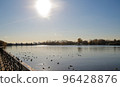 Sun in eclipse near river 96428876