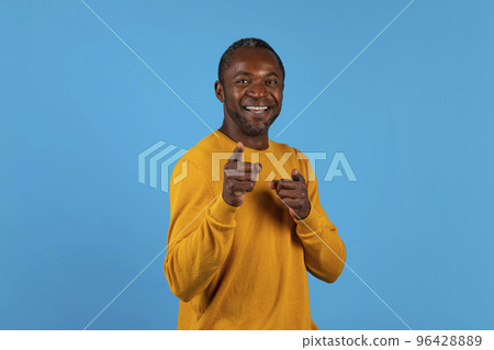 Charismatic handsome black man pointing at camera Charismatic handsome black man pointing at camera 96428889