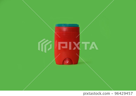 Male deodorant on a bright green background 96429457