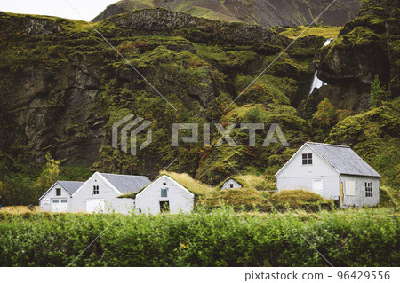 Typical view of turf-top houses in Icelandic countryside 96429556