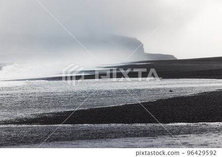 Volcanic Black Sand Beach Reynisfjara waves and fog 96429592