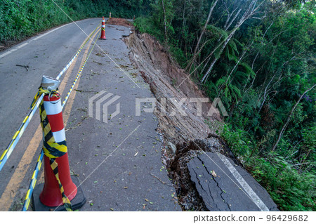 asphalt road damaged by a landslide in a mountain area asphalt road damaged by a landslide in a mountain area 96429682
