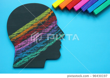 Head with lines drawn with colored crayons. Positive emotions and mindset. 96430197