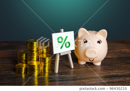 Piggy bank with money and percentage sign. Loan interest rate. Cashback shopping bonus. Return on investment ROI. Favorable offers of deposits by banks. High profitability. Saving money. Piggy bank with money and percentage sign. Loan interest rate. Cashback shopping bonus. Return on investment ROI. Favorable offers of deposits by banks. High profitability. Saving money. 96430210