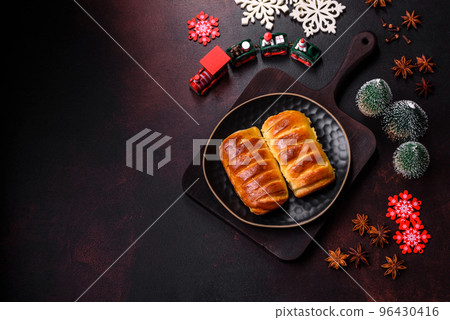 Sweet tasty fresh festive baking on a dark concrete background Sweet tasty fresh festive baking on a dark concrete background 96430416