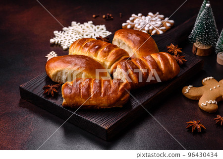 Sweet tasty fresh festive baking on a dark concrete background Sweet tasty fresh festive baking on a dark concrete background 96430434
