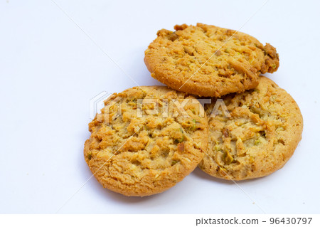 Pistachio and almond cookies on white background. 96430797