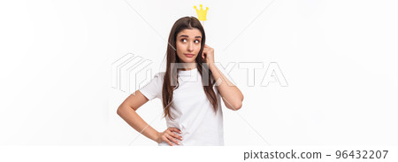 Entertainment, fun and holidays concept. Portrait of sassy and classy good-looking girl in t-shirt, holding carnaval stick with crown, acting like queen or super star, standing white background Entertainment, fun and holidays concept. Portrait of sassy and classy good-looking girl in t-shirt, holding carnaval stick with crown, acting like queen or super star, standing white background 96432207