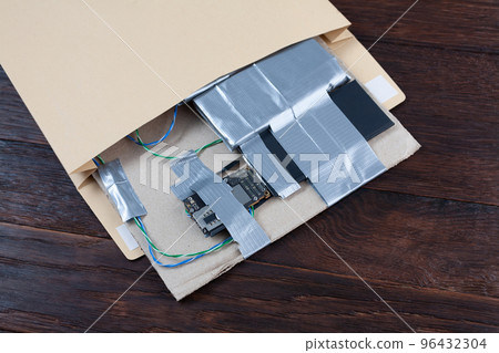 Mail bomb IED - Improvised Explosive Device with c4 and cell phone module in envelope 96432304