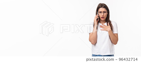 Communication, technology and lifestyle concept. Portrait of concerned and worried young woman express compassion and worry, calling sick friend asking if she okay, hold mobile near ear, touch heart 96432714