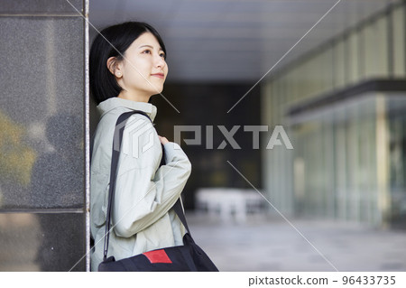 Young Japanese college student enjoying campus life 96433735