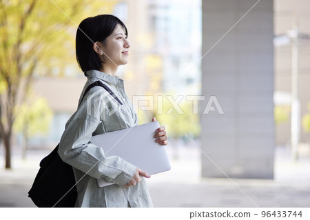 Young Japanese college student enjoying campus life Young Japanese college student enjoying campus life 96433744