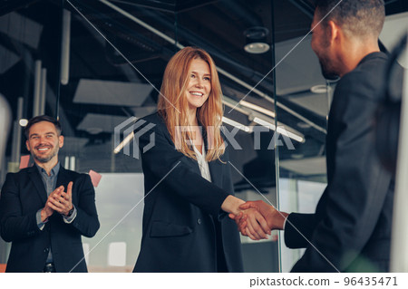 Business male partnership handshake. Photo handshaking process. Successful deal after meeting 96435471