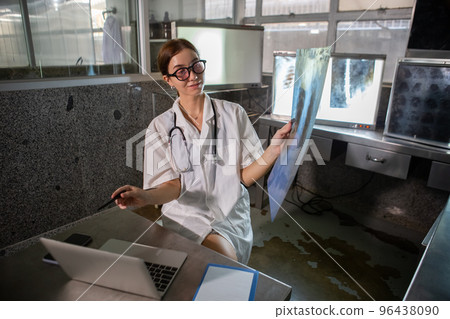 Doctor woman working check up x-ray film in medical laboratory at hospital. 96438090