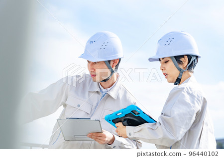 Engineer inspecting equipment Engineer inspecting equipment 96440102