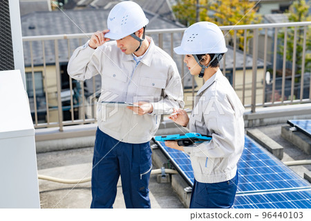 Engineer inspecting equipment 96440103