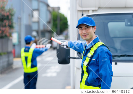 Security guard to guide traffic 96440112