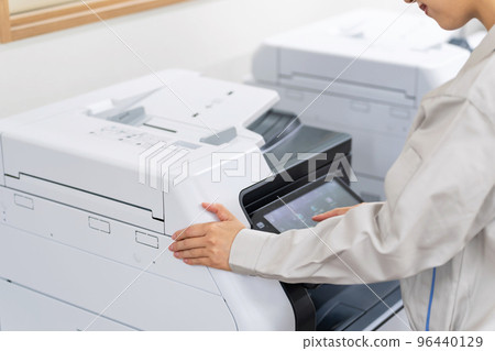 employee using photocopier 96440129