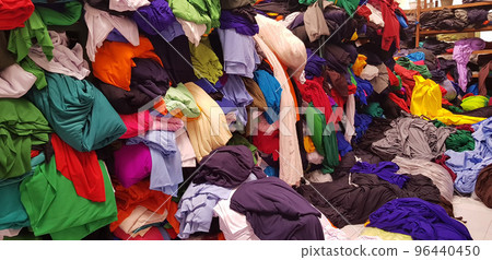 multi colored pile of fabrics, fabric for sewing clothing, fashionable fabric and textile 96440450